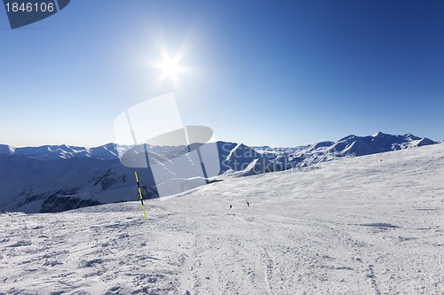 Image of Ski slope and blue sky with sun