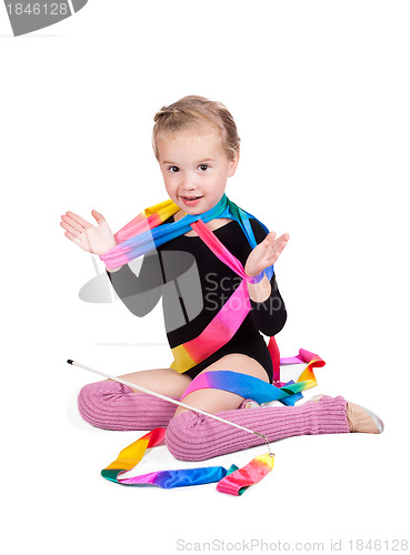 Image of adorable girl gymnast isolated on a white