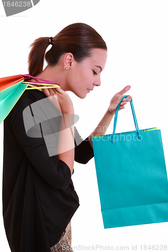 Image of Young beautiful woman with shopping bags