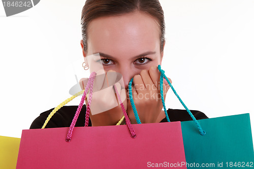 Image of Young beautiful woman with shopping bags