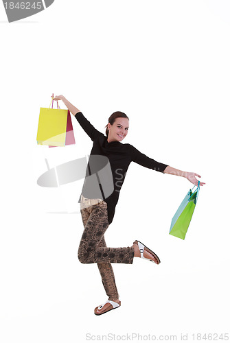 Image of Young beautiful woman with shopping bags