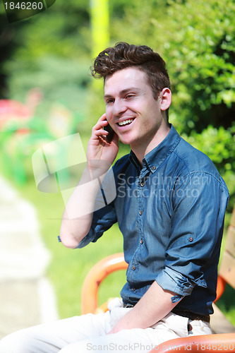 Image of Happy man at telephone