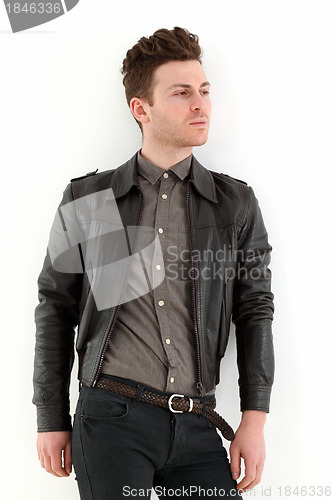 Image of Young adult man posing with leather jacket