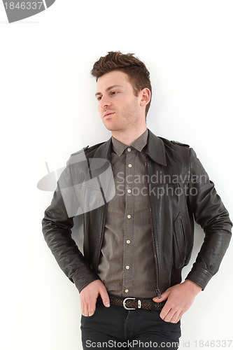 Image of Young adult man posing with leather jacket