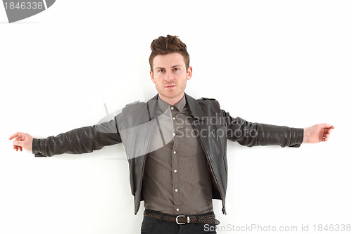 Image of Young adult man posing with leather jacket
