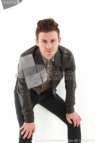 Image of Young adult man posing with leather jacket