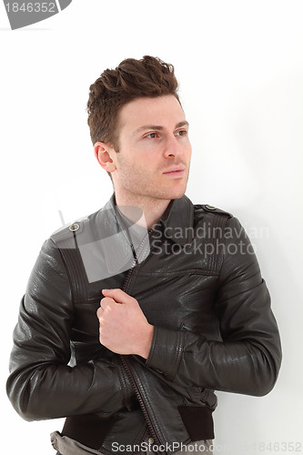 Image of Young adult man posing with leather jacket