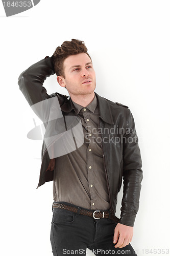 Image of Young adult man posing with leather jacket