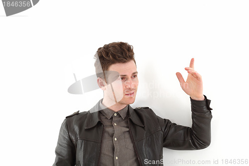 Image of Young adult man posing with leather jacket