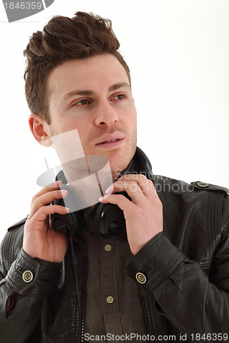 Image of Young adult male portrait listening music