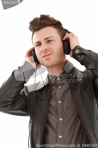 Image of Young adult male listening music