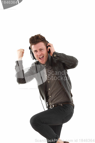 Image of Young adult male dancing and  listening music