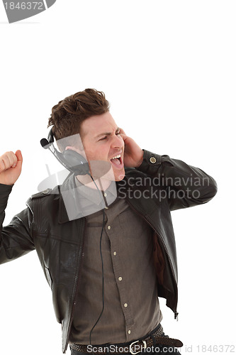 Image of Young adult male louding and listening music