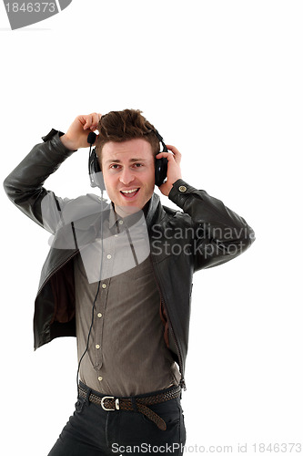 Image of Young adult male listening music