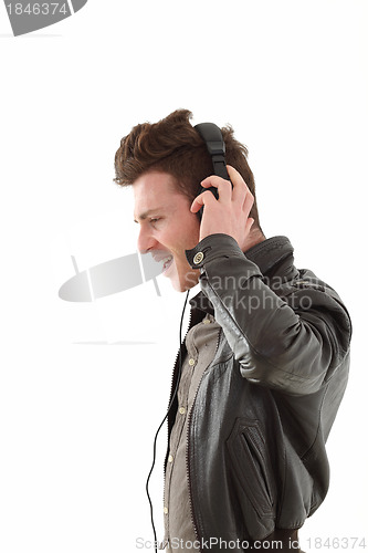 Image of Profile of young adult male listening music