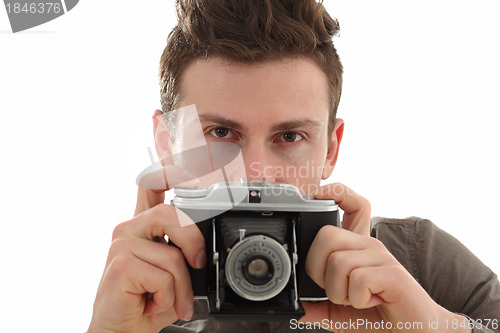Image of Young adult male with olf film camera