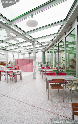 Image of Empty restaurant interior with stage waiting for customers. 