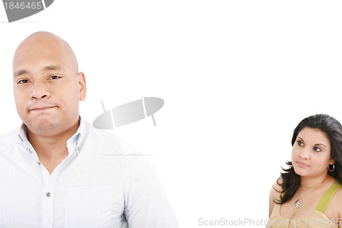 Image of young couple on white background having a dispute. Focus on man