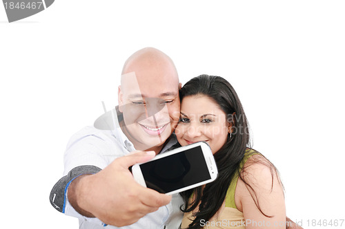 Image of A young couple taking their picture on a mobile phone (focus on 