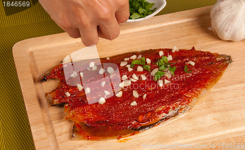 Image of Sprinkling with garlic and parsley