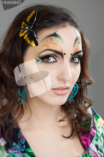 Image of Portrait of beautiful girl with idnian make up