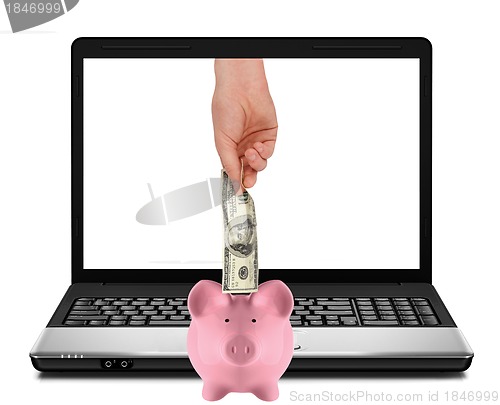 Image of Laptop with piggy bank and hundred dollar