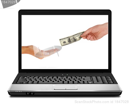Image of US dollars coming from laptop