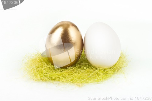 Image of A gold egg with white egg