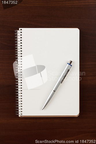 Image of a pen and blank paper