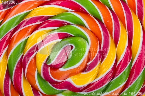 Image of lollypop, twirly abstract background