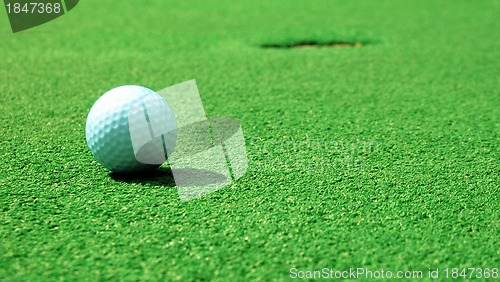 Image of ball into the hole