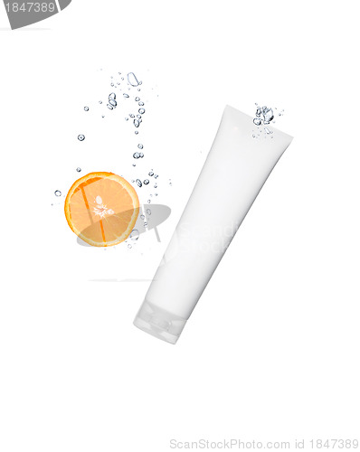 Image of Splashing orange into a water with cosmetic tube