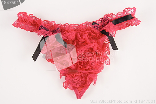 Image of a sexy red garter on a white background