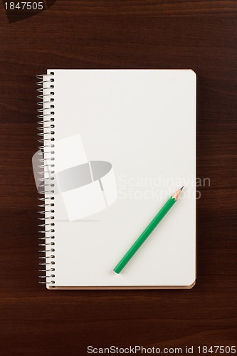 Image of Note book and pencil, isolated on white