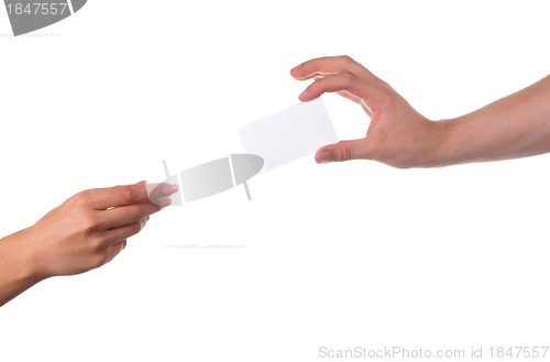 Image of Man and woman hands passing each other a business card