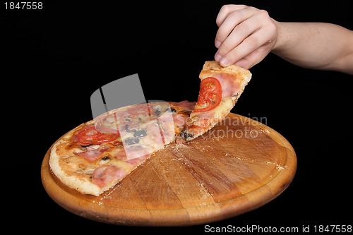 Image of Pizza and slice of pizza in hand