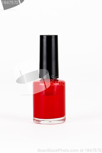 Image of red nail polish bottle on white background