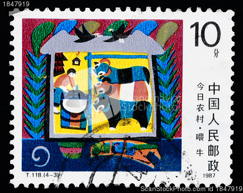 Image of A stamp printed in China shows the modern village