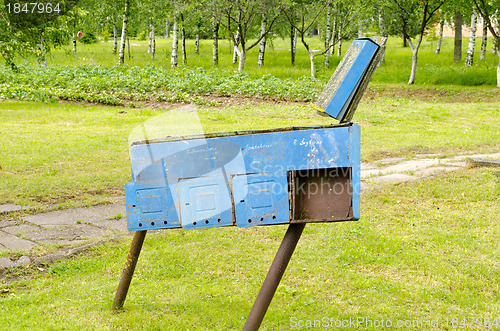 Image of Retro blue rusty postbox with names on it 