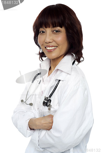 Image of Smiling medical expert posing with arms crossed