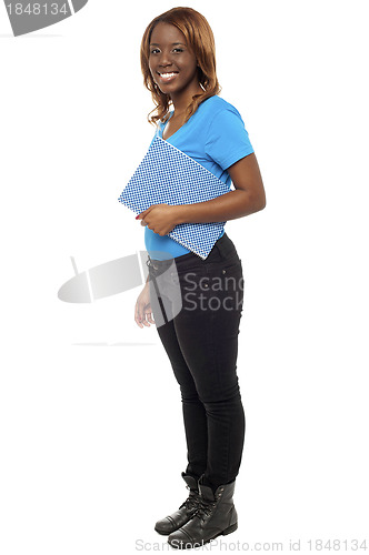 Image of Pretty college student posing with her notebook