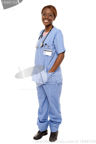 Image of Medical expert posing with hands in her uniform