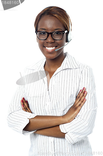 Image of Confident operator lady smiling, wearing headset