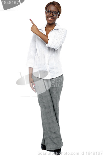 Image of African female secretary pointing at copy space