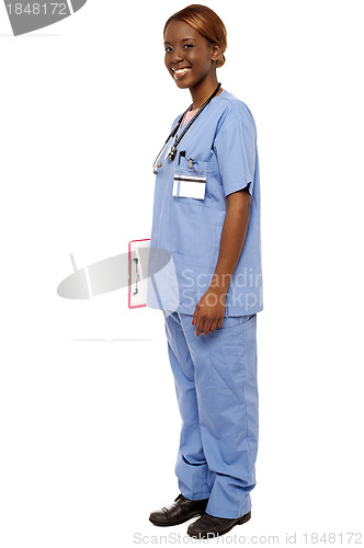 Image of Medical expert holding clipboard, full length shot