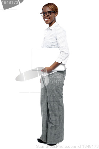 Image of Full length shot of businesswoman with laptop