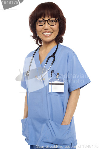 Image of Relaxed female surgeon posing casually