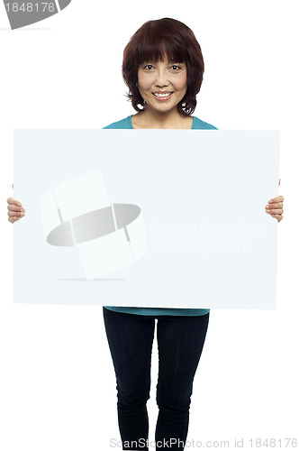 Image of Woman holding billboard, your ad here