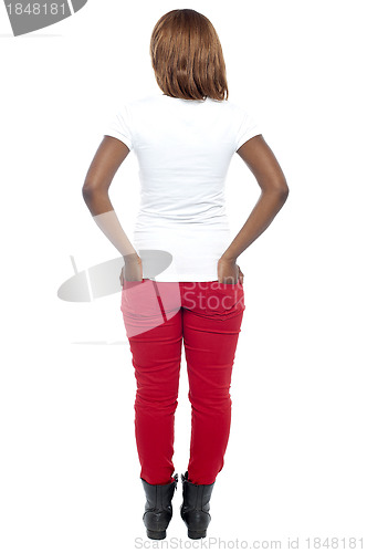 Image of Rear view of african model. Hands in her back pocket