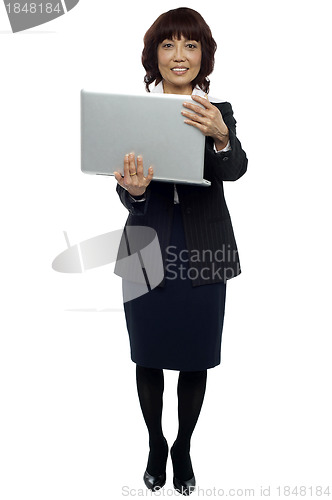 Image of Business representative holding laptop